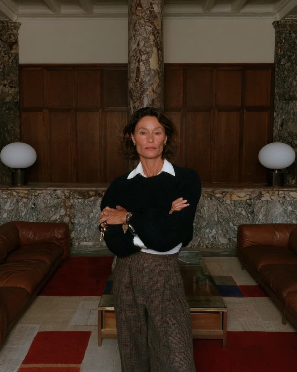 A property owner standing in a furnished living room