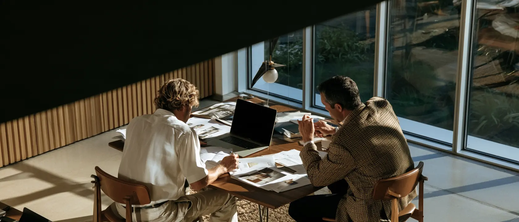 A small operations team working at one table
